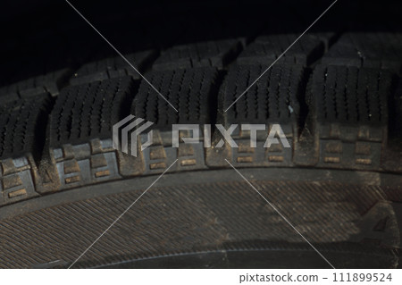 pile of studless tires 111899524