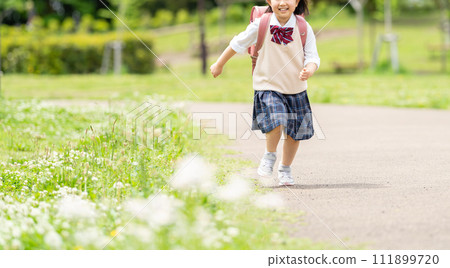 Smiling girl carrying a parcel Smiling girl carrying a parcel 111899720
