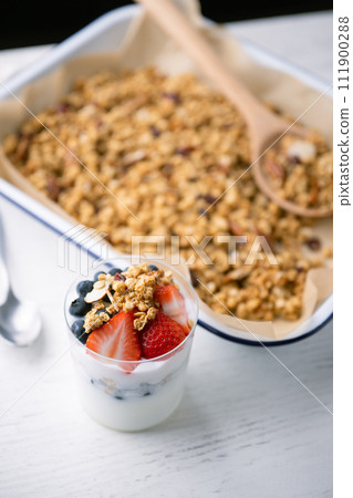 homemade granola with berries and yogurt 111900288