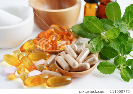 Alternative medicine herbal organic capsule with vitamin E omega 3 fish oil, mineral, drug with herbs leaf natural supplements for healthy good life. 111900773