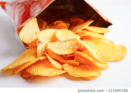 Potato chips in open bag, delicious BBQ seasoning spicy for crips, thin slice deep fried snack fast food. Potato chips in open bag, delicious BBQ seasoning spicy for crips, thin slice deep fried snack fast food. 111900786