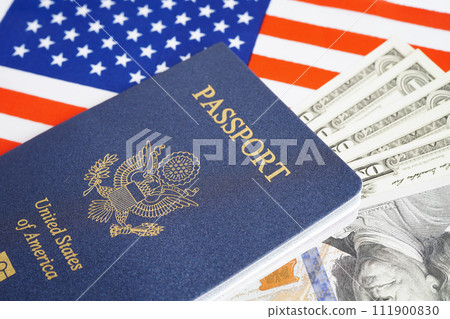 US passport with dollar money on USA flag, American citizen in United States of America. US passport with dollar money on USA flag, American citizen in United States of America. 111900830