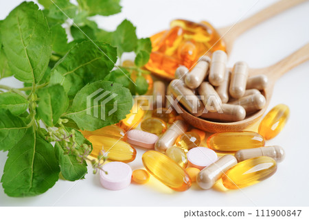 Alternative medicine herbal organic capsule with vitamin E omega 3 fish oil, mineral, drug with herbs leaf natural supplements for healthy good life. Alternative medicine herbal organic capsule with vitamin E omega 3 fish oil, mineral, drug with herbs leaf natural supplements for healthy good life. 111900847