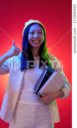 Happy student education woman thumb up textbooks 111900992