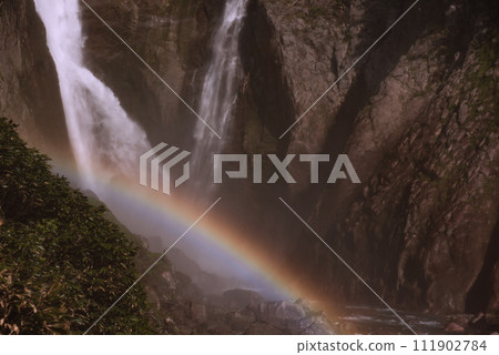Rainbow over the waterfall basin Rainbow over the waterfall basin 111902784