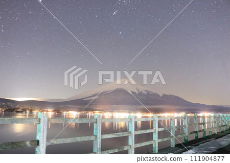 Mt. Fuji and starry sky at Lake Yamanaka on a snowy night 111904877