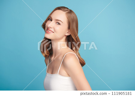 Beautiful young woman with clean fresh skin on blue background, Face care, Facial treatment, Cosmetology, beauty and spa, women portrait. 111905181