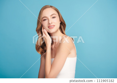 Beautiful young woman with clean fresh skin on blue background, Face care, Facial treatment, Cosmetology, beauty and spa, women portrait. 111905182