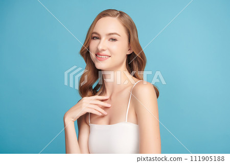 Beautiful young woman with clean fresh skin on blue background, Face care, Facial treatment, Cosmetology, beauty and spa, women portrait. Beautiful young woman with clean fresh skin on blue background, Face care, Facial treatment, Cosmetology, beauty and spa, women portrait. 111905188