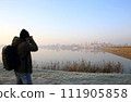 silhouette of a photographer at Mantova, Italy  111905858