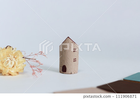 Brown and beige house with dried flowers for a natural look 111906871