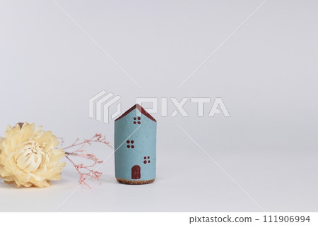 Brown and blue house - natural image with dried flowers 111906994