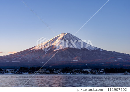 Mt. Fuji in the early morning seen from the shore of Lake Kawaguchi Mt. Fuji in the early morning seen from the shore of Lake Kawaguchi 111907302