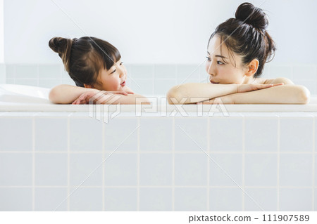 Parent and child entering the bath Parent and child entering the bath 111907589
