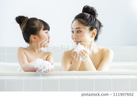 Parent and child entering the bath Parent and child entering the bath 111907602