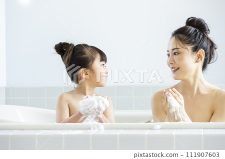 Parent and child entering the bath Parent and child entering the bath 111907603