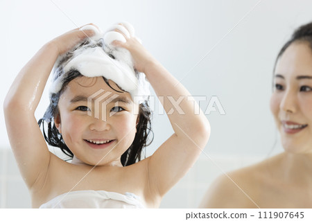Girls washing their hair 111907645