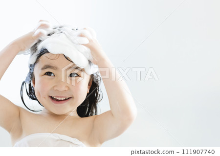 Girls washing their hair 111907740