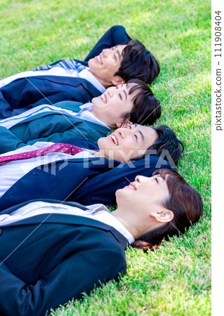 businessman sleeping on the lawn businessman sleeping on the lawn 111908404