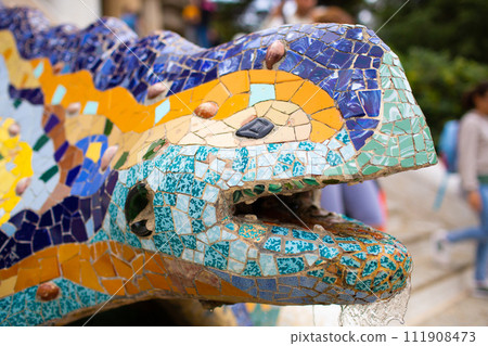 Park Guell detail of the dragon or salamander. 111908473