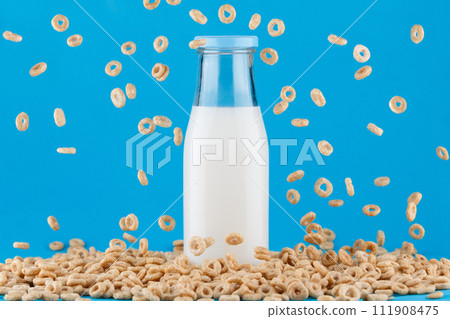 Milk bottle on blue background. Milk bottle on blue background. 111908475