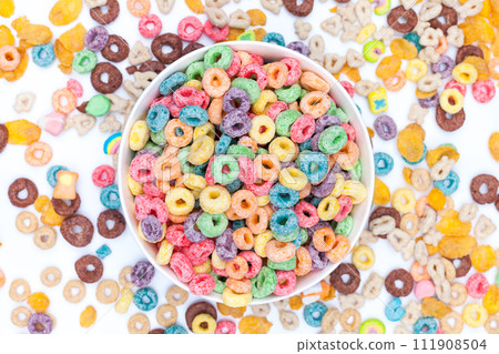 Bowl of colored cereals on white background 111908504