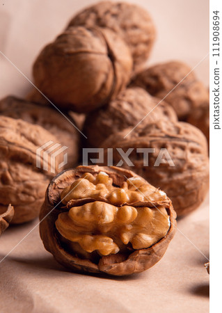 a handful of walnuts on kraft paper 111908694