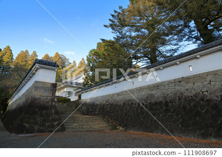View of the stone steps to Nichinan City Obi Castle History Museum under a clear blue sky 111908697
