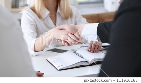 Businessman and woman shake hands Businessman and woman shake hands 111910165