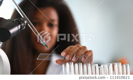 A male chemist holds test tube of glass 111910621