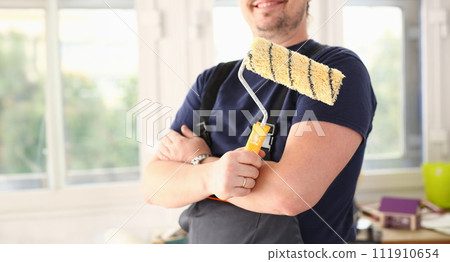 Arm of smiling worker hold brush closeup 111910654