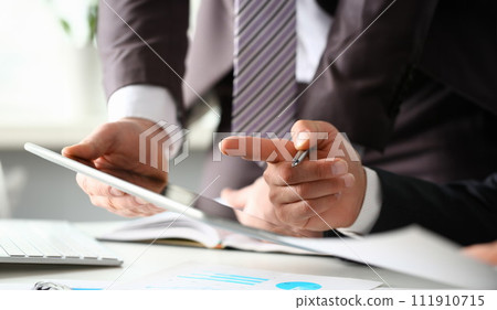 Two businessman are looking and 111910715