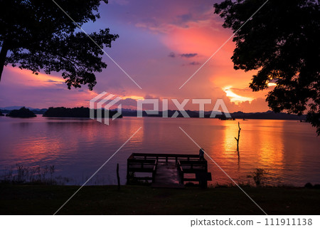 couple at Pom Pee viewpoint dock at sunset, Kanchanaburi couple at Pom Pee viewpoint dock at sunset, Kanchanaburi 111911138