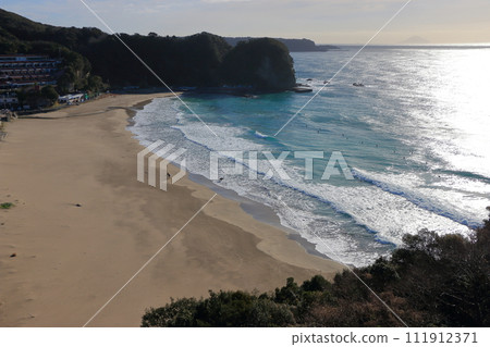 Tatadohama beach at Shimoda on the Izu penninsula of Shizuoka Japan, famous for beautiful white sand, surfing, and nearby onsen hot spring mineral baths 111912371