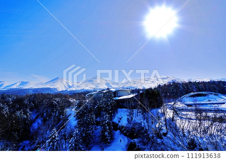 Tokachidake Mountain Range seen from Shirogane Onsen Village, Biei Town, Hokkaido in winter Tokachidake Mountain Range seen from Shirogane Onsen Village, Biei Town, Hokkaido in winter 111913638