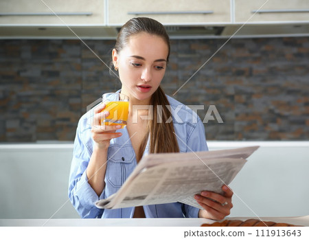 Young beautiful attractive girl in the kitchen 111913643