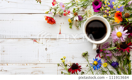 Coffee background with flowers on wooden table Coffee background with flowers on wooden table 111913684