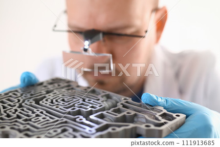 Repairman car-care center on repair holds in hand 111913685