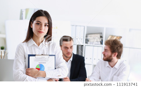 Beautiful smiling cheerful girl at workplace Beautiful smiling cheerful girl at workplace 111913741