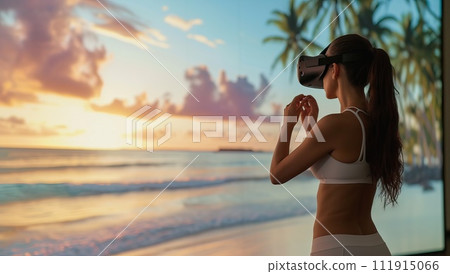Woman wearing virtual reality goggles on the beach at sunrise or sunset. 111915066