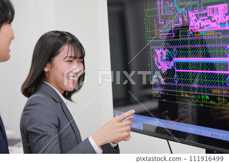 Engineers male and female having a meeting while looking at the CAD screen_3 111916499