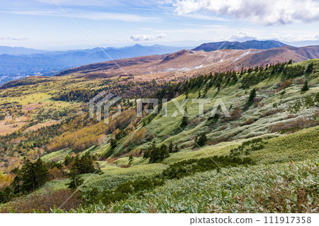 View of Mt. Kusatsu-Shirane from Shibu Pass in autumn on the prefectural border between Gunma and Nagano View of Mt. Kusatsu-Shirane from Shibu Pass in autumn on the prefectural border between Gunma and Nagano 111917358