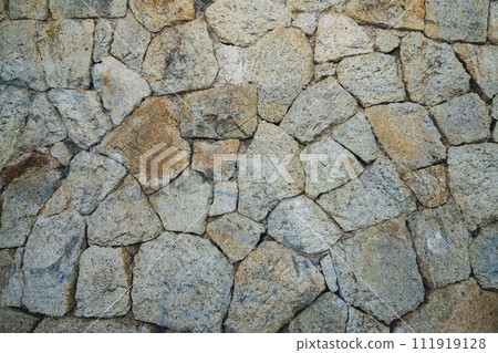 Wall made of decorative wild stone.  Stone wall sample 111919128