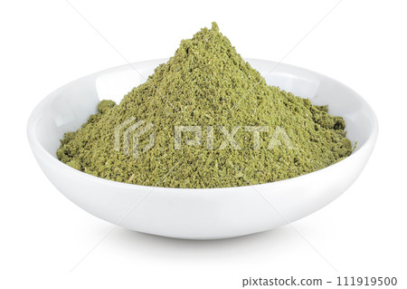 ground Laurel leaves in ceramic bowl isolated on white background. Green bay leaf 111919500