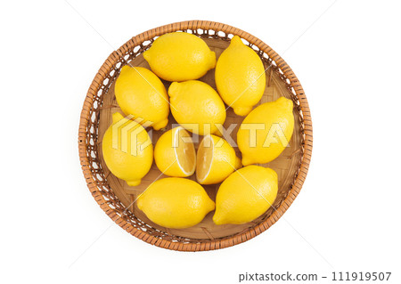Ripe lemons in wicker basket isolated on white background. Top view. Flat lay. 111919507