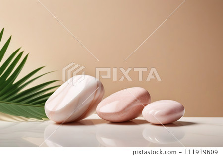 Stones on empty blank marble tabletop desk. Beige wall, beautiful tropical minimalistic backdrop for product presentation. Podium, pedestal. Showcase, display case. Minimal abstract stage mockup. 111919609