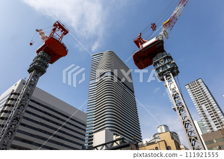 Blue sky, tower crane, and Brillia Tower Dojima high-rise building (Photo taken on February 11, 2024) Blue sky, tower crane, and Brillia Tower Dojima high-rise building (Photo taken on February 11, 2024) 111921555