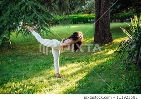 Woman doing yoga exercises asana breathing balance Woman doing yoga exercises asana breathing balance 111923585