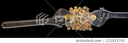 Allegory of the global financial crisis - Iron 10 rubles coin (written ten rubles, Bank of Russia in the Russian) in the grip of economic crisis, on a black background. Finance and business concept Allegory of the global financial crisis - Iron 10 rubles coin (written ten rubles, Bank of Russia in the Russian) in the grip of economic crisis, on a black background. Finance and business concept 111923741