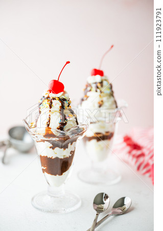 ice cream sundae with cherries and nuts ice cream sundae with cherries and nuts 111923791